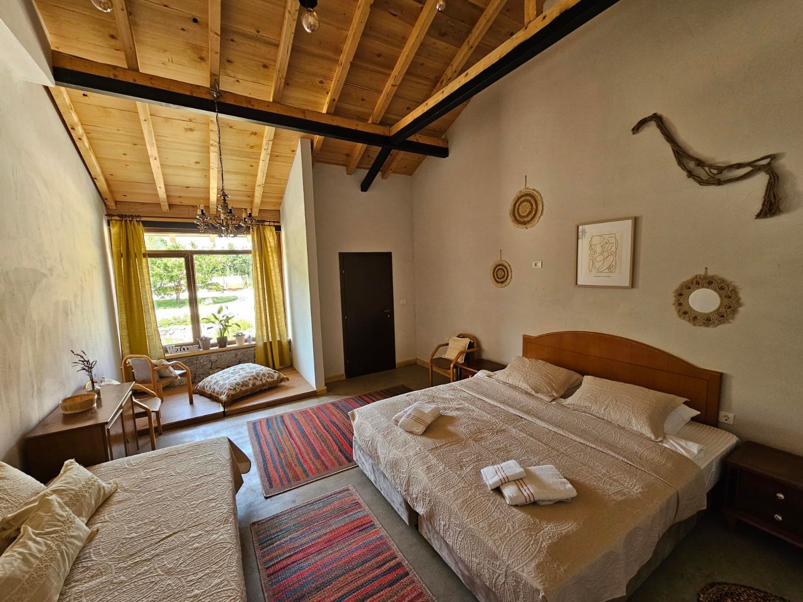 Guest room at Chateau Orman with open-plan sitting area